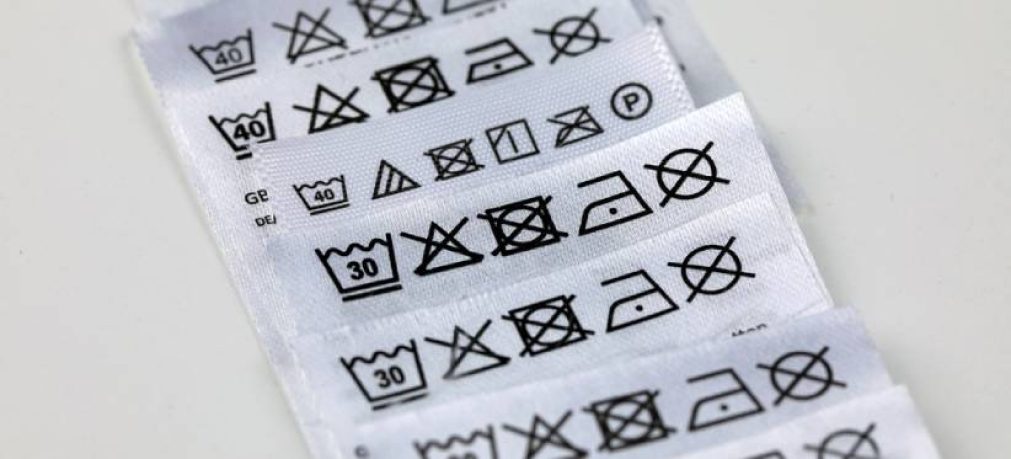 Clothing labels with instructions, expressed by means of graphic symbols, on how to clean the clothes.